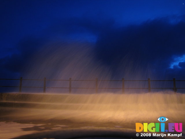 SX01826 Wave rushing over Tramore promenade